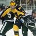 Wolverines Jacob Trouba pushes past Spartans Rj Boyd and Ryan Keller as they sake after the puck during the first period of their game at Yost Ice Arena Friday Feb. 1st.
Courtney Sacco I AnnArbor.com 